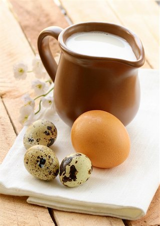 simsearch:400-04499805,k - Ceramic jug with milk and eggs on a wooden table , rustic style Photographie de stock - Aubaine LD & Abonnement, Code: 400-06065519