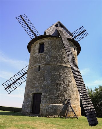 simsearch:400-06101286,k - Back part of a traditional wooden windmill in France in the Eure &Loir Valley region.This is "moulin Froville Pensier" mill. Stock Photo - Budget Royalty-Free & Subscription, Code: 400-06065591
