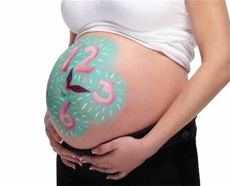 Close up image of pregnant belly with painted clock Stock Photo - Budget Royalty-Free & Subscription, Code: 400-06065739