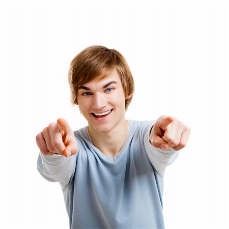 simsearch:400-05912376,k - Portrait of a handsome young man looking and pointing to the camera, isolated over a white background Foto de stock - Super Valor sin royalties y Suscripción, Código: 400-06065843