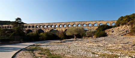 pont du gard - View of Pont du Gard, an old Roman aqueduct in southern France near Nimes Stock Photo - Budget Royalty-Free & Subscription, Code: 400-06066499