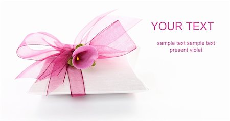 Small gift box decorated with ribbon and flower with copy space for your text Photographie de stock - Aubaine LD & Abonnement, Code: 400-06066798