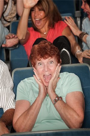 simsearch:400-06138368,k - Seated mature woman screaming out in fear Fotografie stock - Microstock e Abbonamento, Codice: 400-06066863