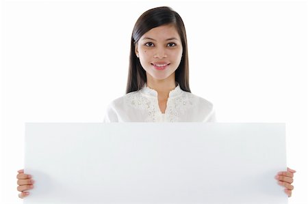 simsearch:400-06071690,k - Mixed race Asian woman holding a white board Photographie de stock - Aubaine LD & Abonnement, Code: 400-06067423