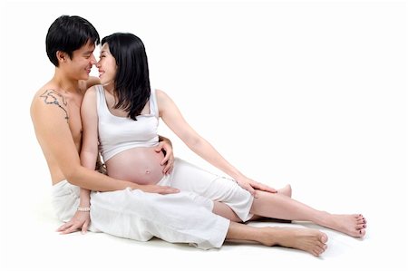 Asian couple, 8 months pregnant women with husband sitting on white background Foto de stock - Super Valor sin royalties y Suscripción, Código: 400-06067430