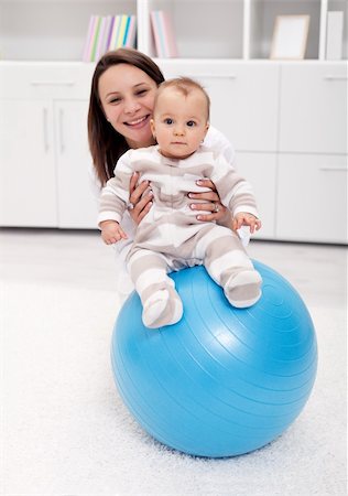 simsearch:400-06073989,k - Baby gymnastic and fun with mother and large ball Photographie de stock - Aubaine LD & Abonnement, Code: 400-06068494