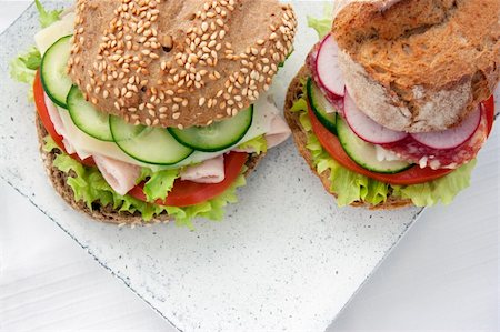 simsearch:400-05881424,k - Delicious ham, cheese and salami sandwich with vegetables, lettuce, cherry tomatoes Stockbilder - Microstock & Abonnement, Bildnummer: 400-06068647