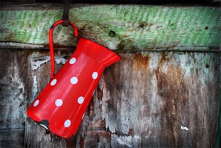 Vintage red jug hanging on rustic wooden wall Stock Photo - Budget Royalty-Free & Subscription, Code: 400-06068664