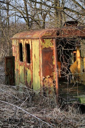 Long ago abandoned trailer forgotten in the woods vertical view Stock Photo - Budget Royalty-Free & Subscription, Code: 400-06069225