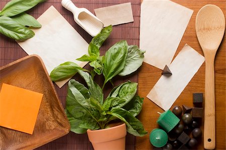recipes paper - Directly above photograph of basil leaves, papers, and decorative objects for herbal medicine or culinary topics. Add your text to the papers. Foto de stock - Super Valor sin royalties y Suscripción, Código: 400-06069242