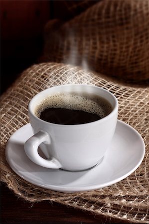 cup of black coffee on the linen cloth Foto de stock - Royalty-Free Super Valor e Assinatura, Número: 400-06069925