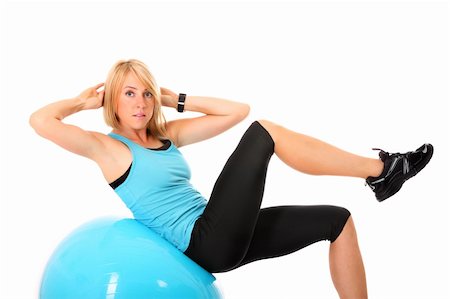 A picture of a beautiful young fit woman doing sit-ups on a ball over white background Stock Photo - Budget Royalty-Free & Subscription, Code: 400-06060717