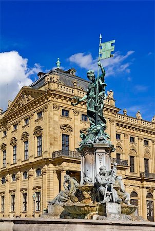 Franconia fountain in front of Residence Palace in Wurzburg, Germany. The palace is one of Europe’s most renowned baroque castle and it is registered as a UNESCO World Cultural Heritage Site. Stockbilder - Microstock & Abonnement, Bildnummer: 400-06060725