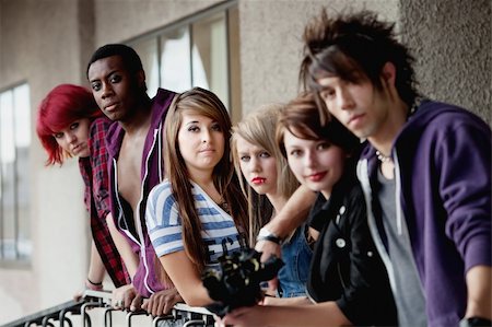 Attractive young teen punks look at the camera as it selectively focuses on the brunette in the middle. Stock Photo - Budget Royalty-Free & Subscription, Code: 400-06060886