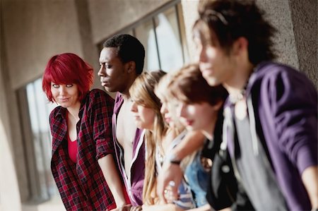 A group of young punk rock teens stare off into the distance as one looks towards the camera. Stock Photo - Budget Royalty-Free & Subscription, Code: 400-06060882