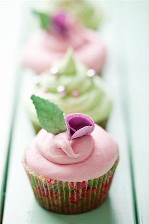 pink cupcake flowers - closeup of beautiful summer cupcake with strawberry flavoured cream Stock Photo - Budget Royalty-Free & Subscription, Code: 400-06061030