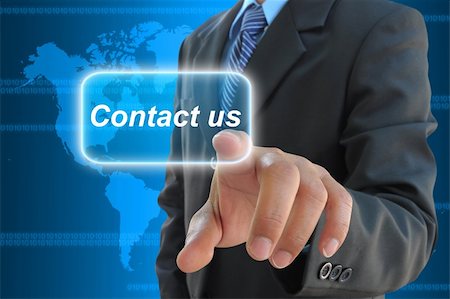 businessman hand pushing contact us button on a touch screen interface Stock Photo - Budget Royalty-Free & Subscription, Code: 400-06061102