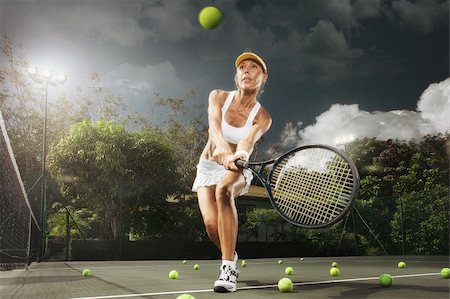 portrait of young beautiful woman playing tennis in summer environment Stock Photo - Budget Royalty-Free & Subscription, Code: 400-06061563