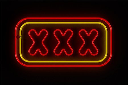 Triple X neon sign illuminated over dark background Stock Photo - Budget Royalty-Free & Subscription, Code: 400-06061918