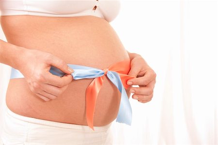 Pregnant woman expecting a baby or baby girl Stockbilder - Microstock & Abonnement, Bildnummer: 400-06062648