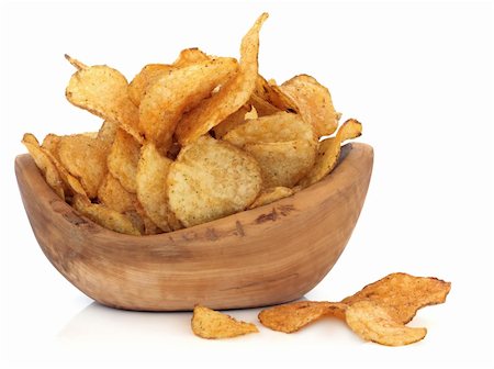 simsearch:400-07993657,k - Cheese and chive potato crisp snack in an olive wood bowl over white background. Photographie de stock - Aubaine LD & Abonnement, Code: 400-06062660