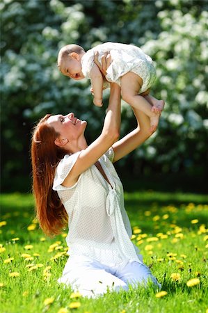 simsearch:400-06062677,k - Happy mother and daughter on the green grass Photographie de stock - Aubaine LD & Abonnement, Code: 400-06062678