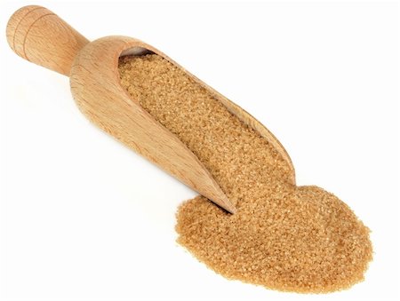 simsearch:400-04268388,k - Demerara brown sugar in a wooden scoop over white background. Stock Photo - Budget Royalty-Free & Subscription, Code: 400-06062704