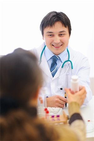 simsearch:400-07099832,k - Smiling medical doctor giving pills to patient Stock Photo - Budget Royalty-Free & Subscription, Code: 400-06062813