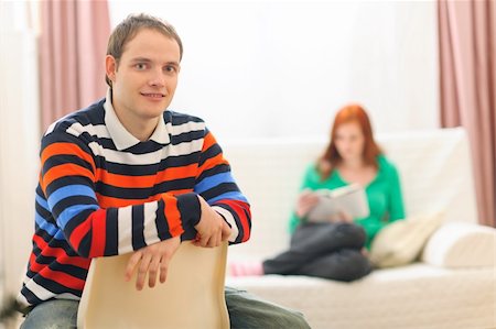 simsearch:400-07712720,k - Portrait of young man and girlfriend reading in background Stock Photo - Budget Royalty-Free & Subscription, Code: 400-06062852