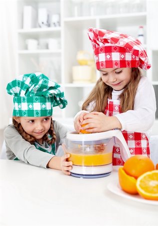 extractor - Little girls making fresh orange juice in the kitchen - healthy life education Stock Photo - Budget Royalty-Free & Subscription, Code: 400-06063009