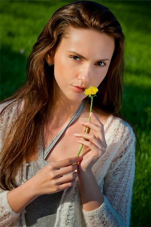 simsearch:400-04107729,k - Girl with dandelion on green field Stock Photo - Budget Royalty-Free & Subscription, Code: 400-06063064