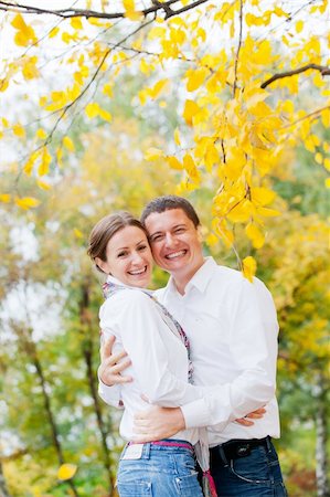 simsearch:400-05911333,k - Portrait of romantic happy young beautiful couple on autumn walk. Vertical view Fotografie stock - Microstock e Abbonamento, Codice: 400-06063094