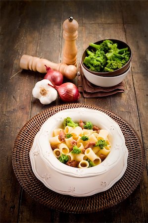 photo of delicious pasta with sausage and broccoli on wooden table Stockbilder - Microstock & Abonnement, Bildnummer: 400-06063253