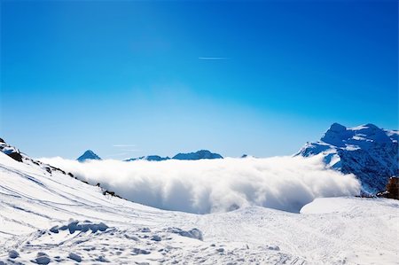 dinga (artist) - Sun and clouds over winter mountains, covered with snow Fotografie stock - Microstock e Abbonamento, Codice: 400-06063482