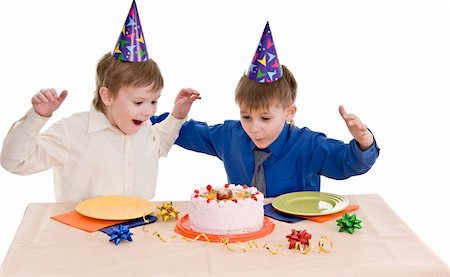 two happy boy with a cake isolated on white background Stock Photo - Budget Royalty-Free & Subscription, Code: 400-06063557