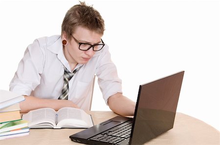 simsearch:400-05678148,k - male student works on the laptop isolated on white background Stockbilder - Microstock & Abonnement, Bildnummer: 400-06063564