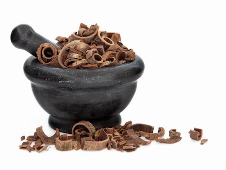 simsearch:400-07174356,k - Magnolia bark herb used in traditional chinese herbal medicine in a black marble mortar with pestle over white background. Hu pou Stock Photo - Budget Royalty-Free & Subscription, Code: 400-06063648