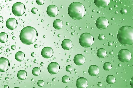 Close up of water drops on green glass surface as background Stockbilder - Microstock & Abonnement, Bildnummer: 400-06063661