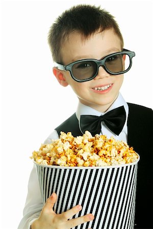 simsearch:400-09091954,k - Young boy with popcorn and HD glasses isolated on white background Stock Photo - Budget Royalty-Free & Subscription, Code: 400-06063931