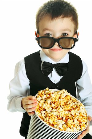 simsearch:400-09091954,k - Young boy with popcorn and HD glasses isolated on white background Stock Photo - Budget Royalty-Free & Subscription, Code: 400-06063932