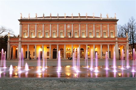 fountain plaza statue - view of "Romolo Valli" Municipal Theater in Reggio Emilia, north of Italy, with enlightened modern fountain Stock Photo - Budget Royalty-Free & Subscription, Code: 400-06074246