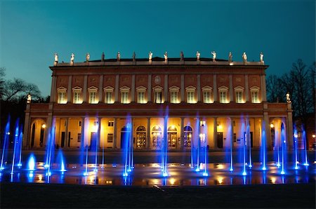 fountain plaza statue - view of "Romolo Valli" Municipal Theater in Reggio Emilia, north of Italy, with enlightened modern fountain Stock Photo - Budget Royalty-Free & Subscription, Code: 400-06074247