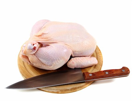 raw chicken dishes - Uncooked chicken and knife on a cutting board. Stock Photo - Budget Royalty-Free & Subscription, Code: 400-06074397