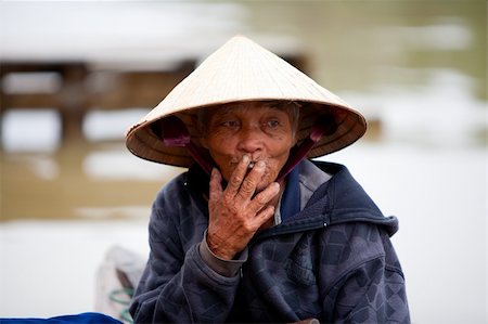 Elderly Vietnamese man in Hoi An, Vietnam Stock Photo - Budget Royalty-Free & Subscription, Code: 400-06074402