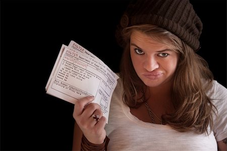 Unhappy woman with welfare food coupons over dark background Stock Photo - Budget Royalty-Free & Subscription, Code: 400-06075198