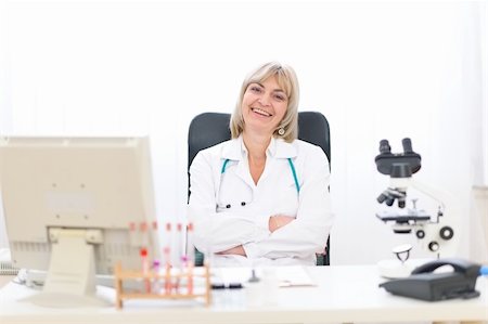 simsearch:400-07099889,k - Happy mature doctor woman at office Stock Photo - Budget Royalty-Free & Subscription, Code: 400-06076025