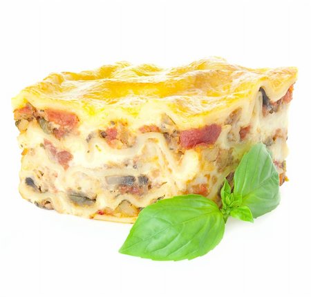 simsearch:400-07972143,k - Home-baked hot Lasagne with fresh Basil / Isolated on white / Focus is all over Photographie de stock - Aubaine LD & Abonnement, Code: 400-06076275