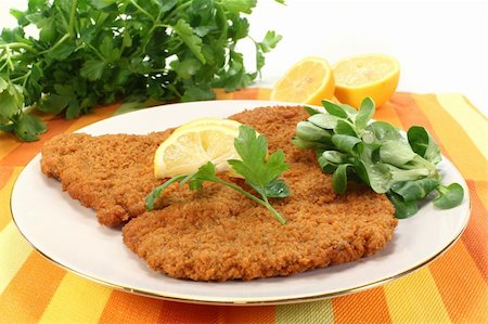 Viennese-style schnitzel with lemon and parsley Stock Photo - Budget Royalty-Free & Subscription, Code: 400-06076525