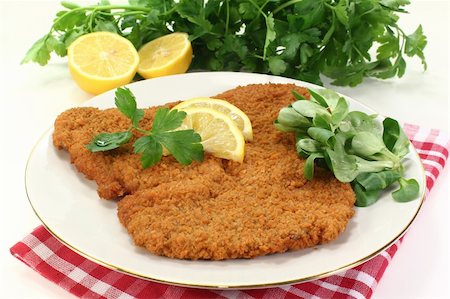 Viennese-style schnitzel with lemon and parsley Stock Photo - Budget Royalty-Free & Subscription, Code: 400-06076529