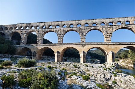 pont du gard - View of Pont du Gard, an old Roman aqueduct in southern France near Nimes Stock Photo - Budget Royalty-Free & Subscription, Code: 400-06076774